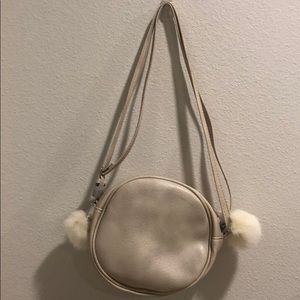 Champagne colored circle mini bag with poofs!